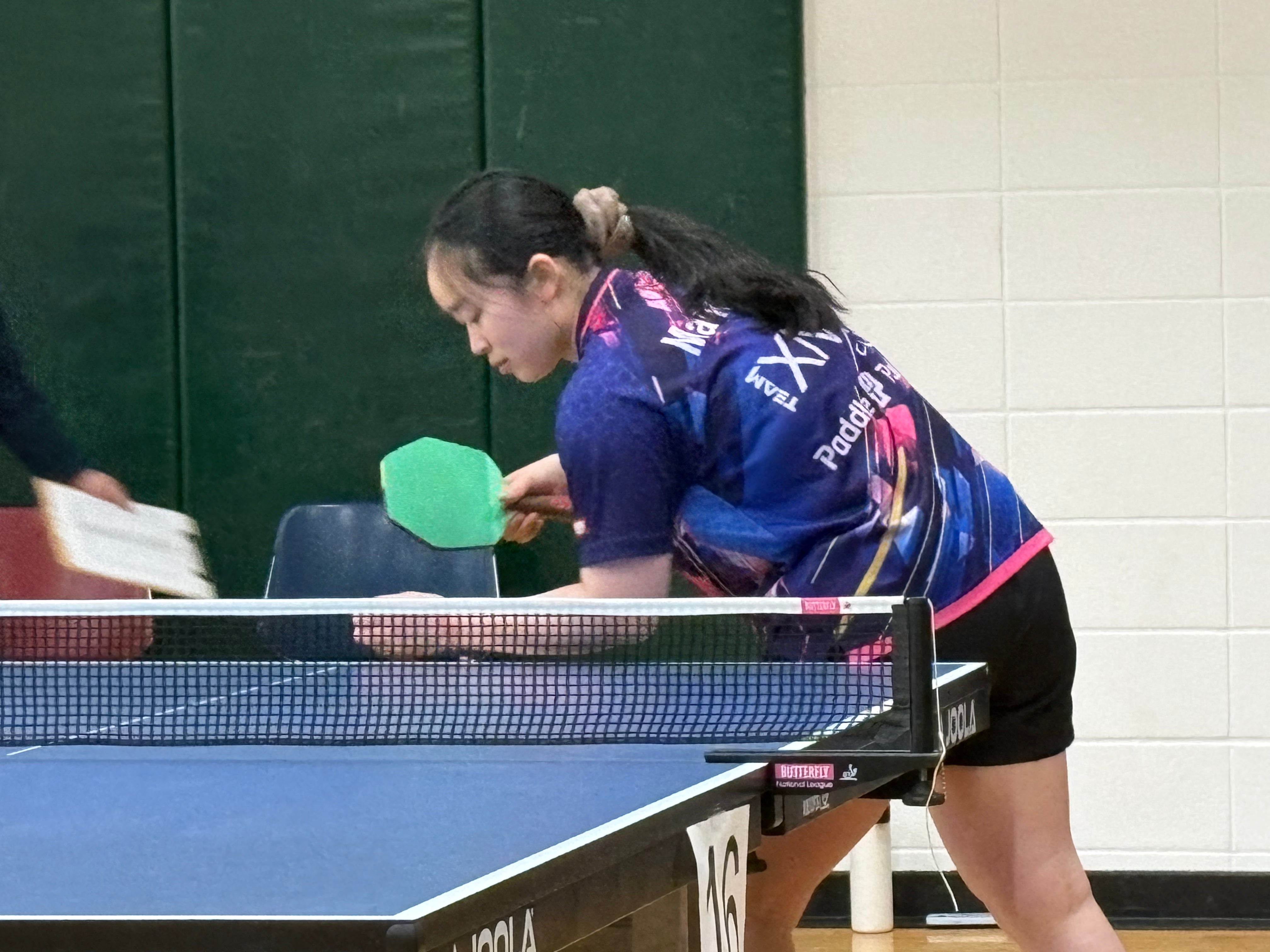 Mandy Wu serving up the action at the 2026 Minnesota State High School Team Championships